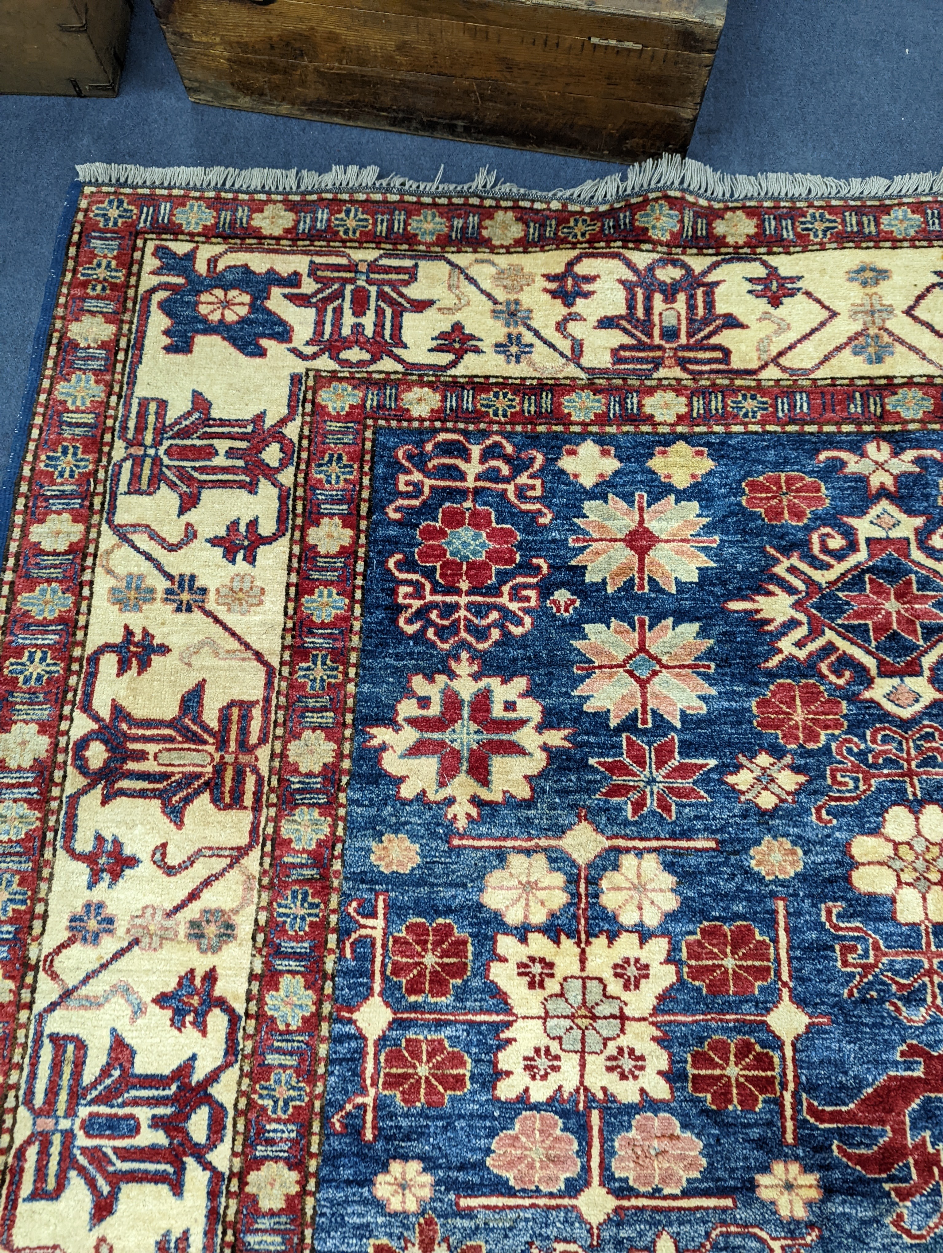 A Kazak blue ground carpet, 242 x 186cm